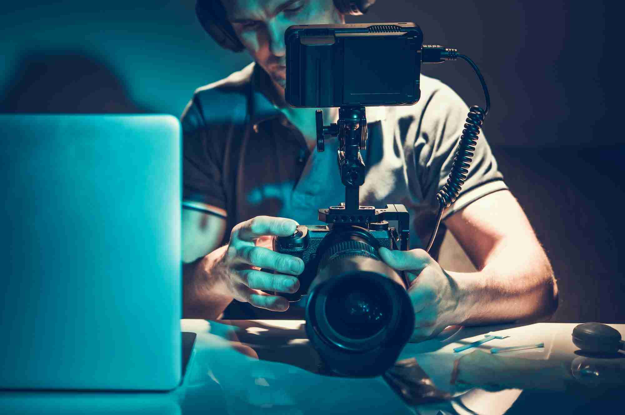 Camera Operator Reviewing Video Material on Display